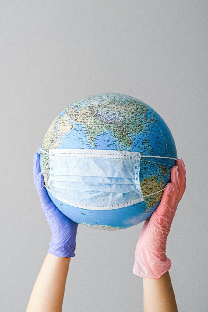 A globe wearing a mask